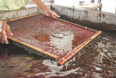 High angle view of person preparing food on table