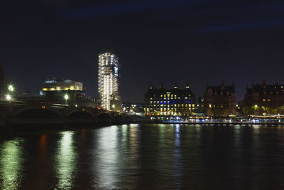 Illuminated buildings at waterfront