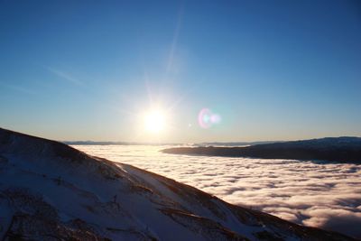 Scenic view of snowcapped mountains against sky during winter