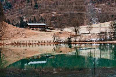 A mountain lake landscape in the alps with turquoise water and reflections on the water surface