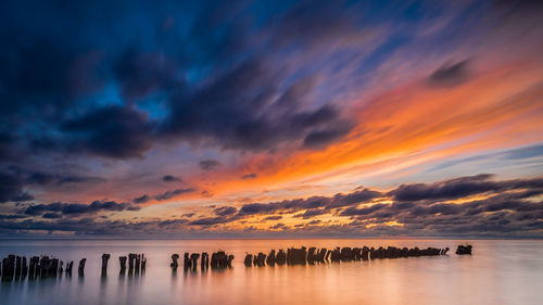 Scenic view of sea against sky at sunset