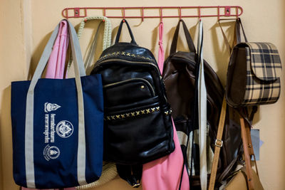 Close-up of clothes drying on rack against wall