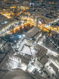 High angle view of illuminated street in city during winter