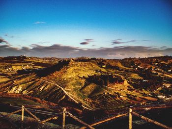 Scenic view of landscape against blue sky