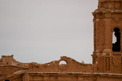 Low angle view of old building against clear sky