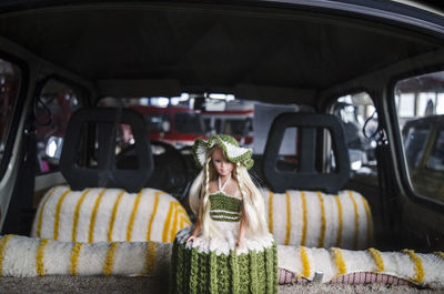 Portrait of young woman in car
