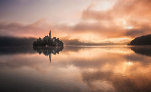 Reflection of clouds in lake during sunset