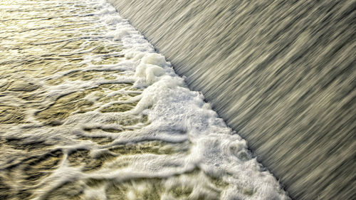 High angle view of surf on beach