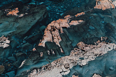 High angle view of rock formations in sea