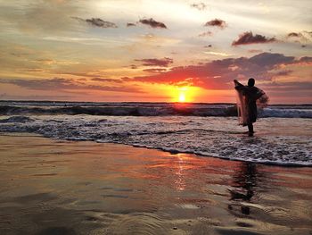 Scenic view of sea at sunset