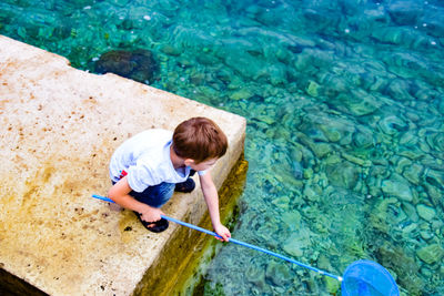 High angle view of boy fishing in 