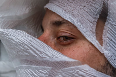 Close-up of man covered in plastic