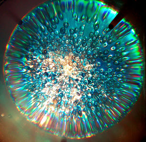 Close-up of illuminated fireworks against sky at night