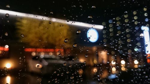 Close-up of wet airplane window