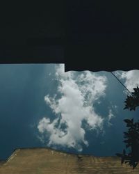 Low angle view of built structure against cloudy sky