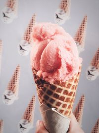 Close-up of hand holding ice cream cone