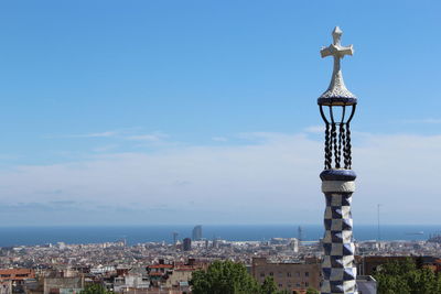 Tower at park guell against residential district