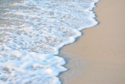 High angle view of surf on beach