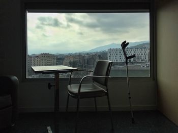 Chairs and table by window