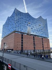 Low angle view of modern buildings against sky