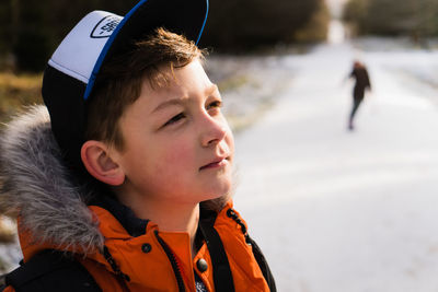 Close-up of boy with snow