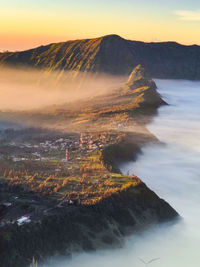 Aerial view of landscape against sky during sunset