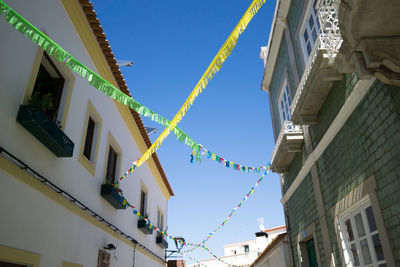 Low angle view of buildings against blue sky