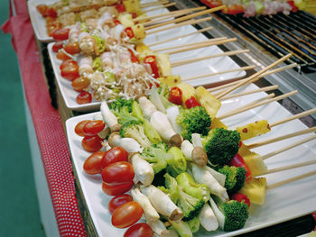 High angle view of vegetable barbecue sticks ready to grill