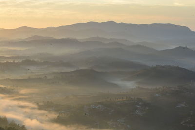 High angle view of mountains against sky during sunset