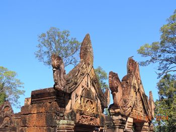 Low angle view of statue against sky