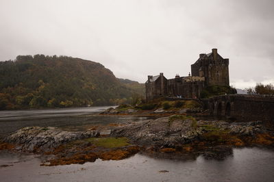 View of fort by river against sky