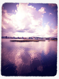 Scenic view of sea against cloudy sky