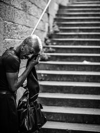 Man looking down on staircase