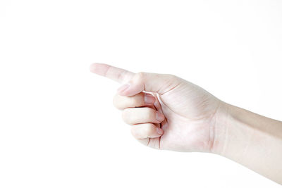 Close-up of human hand against white background