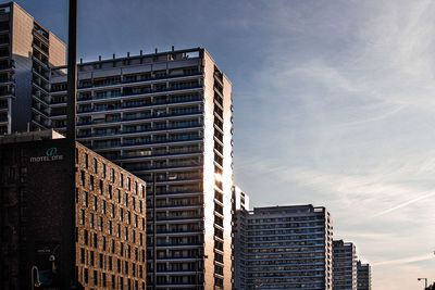 Low angle view of buildings against sky in city