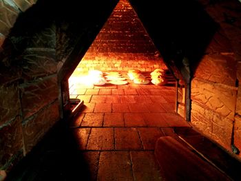 Illuminated tunnel at night