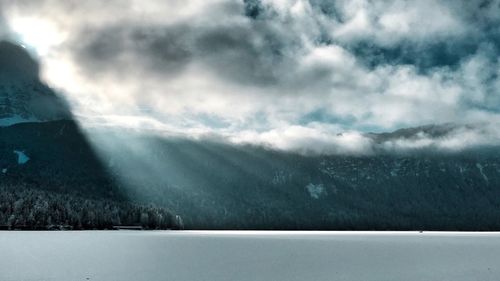 Scenic view of landscape against sky during winter