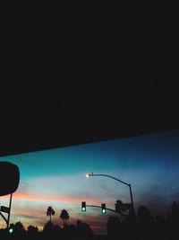 Low angle view of street light against sky