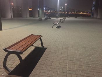 Empty bench at night