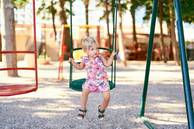 Full length of boy playing at playground