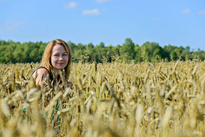 Portrait of smiling young woman in farm