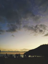 Silhouette of people at sunset