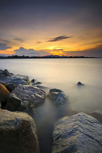 Scenic view of sea against sky during sunset