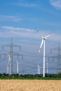 Wind turbines, power lines and electricity pylons seen in germany