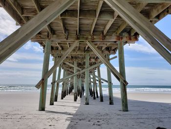 Pier over sea against sky