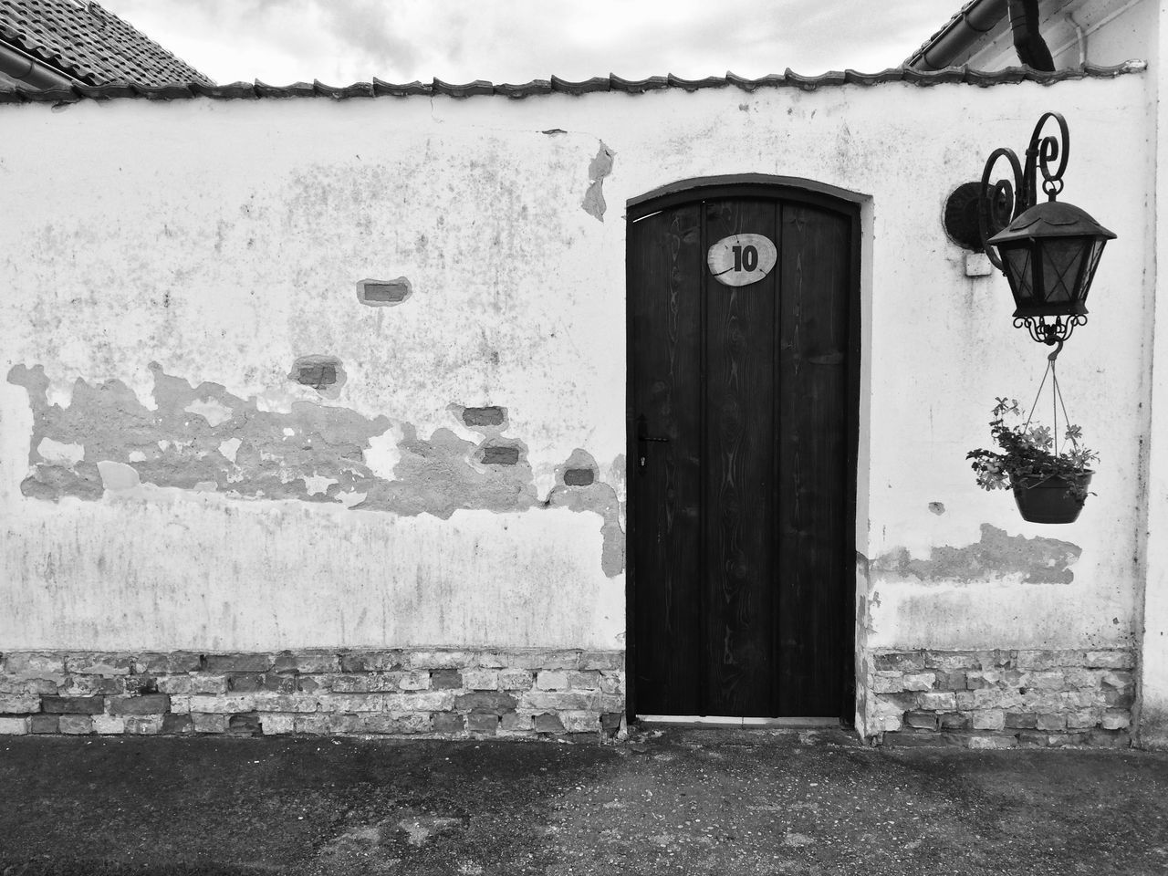 CLOSED DOOR OF OLD HOUSE