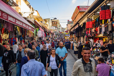 People walking on street market in city