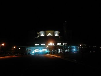 View of illuminated road at night