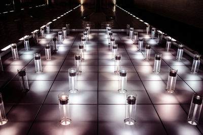 Illuminated electric lights on tiled floor