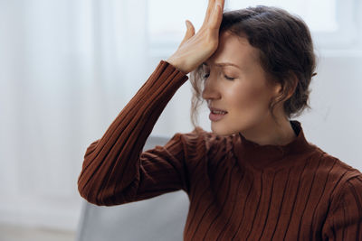 Side view of young woman looking away